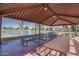 This community pavilion offers shaded picnic tables with views of the lake and grassy areas at 1718 S Longmore -- # 95, Mesa, AZ 85202