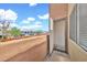 An open balcony with a view of the neighborhood and bright blue sky at 1718 W Colter St # 195, Phoenix, AZ 85015