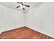A cozy bedroom featuring a ceiling fan and hardwood floors at 1718 W Colter St # 195, Phoenix, AZ 85015