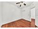 A cozy bedroom with a ceiling fan and hardwood floors at 1718 W Colter St # 195, Phoenix, AZ 85015