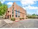 Attractive two-story stucco building with large windows, landscaping, and assigned parking spots at 1718 W Colter St # 195, Phoenix, AZ 85015