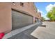 Exterior view of the garage doors with desert landscape at 1718 W Colter St # 195, Phoenix, AZ 85015