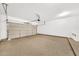 Open garage with speckled concrete flooring, ample lighting at 1718 W Colter St # 195, Phoenix, AZ 85015