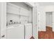 Convenient laundry room with shelving and a washer/dryer at 1718 W Colter St # 195, Phoenix, AZ 85015