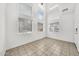 Bright and airy living room with floor-to-ceiling windows and tile flooring for easy maintenance at 1718 W Colter St # 195, Phoenix, AZ 85015