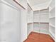 A very clean walk-in closet with hanging rods and adjustable shelving at 1718 W Colter St # 195, Phoenix, AZ 85015