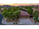 Aerial shot of a single-Gathering home highlighting the tile roof and beautiful desert landscaping at 2038 W Whisper Rock Trl, Phoenix, AZ 85085