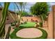 Backyard with putting green, sand trap, and fire pit at 2038 W Whisper Rock Trl, Phoenix, AZ 85085