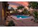 Outdoor pool area with stone-paved walkway and beautiful landscaping at 2038 W Whisper Rock Trl, Phoenix, AZ 85085