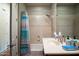 Bathroom featuring a shower-tub combo with a patterned shower curtain and sink with large mirror at 2038 W Whisper Rock Trl, Phoenix, AZ 85085