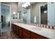 Bathroom with a large vanity with dual sinks and mirrors that open to different areas of the house at 2038 W Whisper Rock Trl, Phoenix, AZ 85085