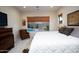 Tranquil bedroom offering a relaxing view of the pool and well-lit spaces at 2038 W Whisper Rock Trl, Phoenix, AZ 85085
