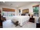 Serene bedroom with large windows, neutral decor, and a relaxing atmosphere at 2038 W Whisper Rock Trl, Phoenix, AZ 85085