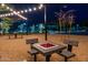 Outdoor gathering area with picnic tables and game boards, ideal for community events at 2038 W Whisper Rock Trl, Phoenix, AZ 85085