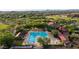 Aerial view of the community pool in Sonoran Foothills surrounded by lounge chairs, landscaping, and buildings at 2038 W Whisper Rock Trl, Phoenix, AZ 85085