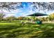 Well-maintained dog park in Sonoran Foothills Community Park, featuring green grass and agility equipment at 2038 W Whisper Rock Trl, Phoenix, AZ 85085