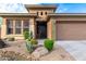 Well-maintained home exterior featuring desert landscaping and a welcoming front entrance at 2038 W Whisper Rock Trl, Phoenix, AZ 85085