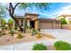 Inviting single-Gathering home exterior featuring desert landscaping and a spacious three-car garage at 2038 W Whisper Rock Trl, Phoenix, AZ 85085
