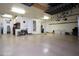 Spacious garage with epoxy flooring, storage racks, and ample room for parking at 2038 W Whisper Rock Trl, Phoenix, AZ 85085