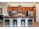 Charming kitchen with wooden cabinets, modern appliances, and an inviting breakfast bar for casual dining at 2038 W Whisper Rock Trl, Phoenix, AZ 85085