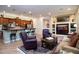 Cozy living room featuring wooden cabinets, stainless steel appliances, and comfortable seating at 2038 W Whisper Rock Trl, Phoenix, AZ 85085