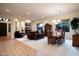 Spacious living room with a fireplace, an adjacent dining area, and tile and carpet flooring at 2038 W Whisper Rock Trl, Phoenix, AZ 85085