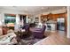 Inviting living room with cozy seating, an open floor plan, and a view into the kitchen at 2038 W Whisper Rock Trl, Phoenix, AZ 85085