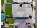 Bird's eye view of a home with artificial turf, pool, and well-maintained roof at 22728 E Camacho Rd, Queen Creek, AZ 85142