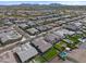 Expansive aerial view showcases a well-maintained community with landscaped yards at 22728 E Camacho Rd, Queen Creek, AZ 85142