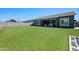 Lush artificial turf backyard, perfect for play, extends to the rear of the home at 22728 E Camacho Rd, Queen Creek, AZ 85142