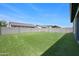 Spacious backyard with artificial turf and play structure, great for outdoor fun at 22728 E Camacho Rd, Queen Creek, AZ 85142