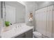 Stylish bathroom with vanity, framed mirror, and a shower with a decorative curtain at 22728 E Camacho Rd, Queen Creek, AZ 85142