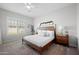 Inviting bedroom with a comfortable bed, soft lighting, and a serene atmosphere for relaxation and restful sleep at 22728 E Camacho Rd, Queen Creek, AZ 85142