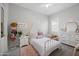 Serene bedroom featuring a white bed, neutral decor, and soft textures for a relaxing space at 22728 E Camacho Rd, Queen Creek, AZ 85142