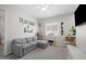 Versatile bedroom with a gray sectional, playful decor, and a cozy atmosphere at 22728 E Camacho Rd, Queen Creek, AZ 85142