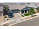An attractive home exterior features stylish landscaping and a spacious driveway at 22728 E Camacho Rd, Queen Creek, AZ 85142
