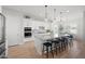 Modern kitchen featuring a large island with barstool seating and stainless-steel appliances at 22728 E Camacho Rd, Queen Creek, AZ 85142