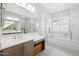 Elegant main bathroom featuring double sinks, a soaking tub, a walk-in shower, and modern fixtures at 22728 E Camacho Rd, Queen Creek, AZ 85142