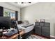 This bedroom features a bed, a desk with a computer, and a dresser with drawers at 2721 E Schiliro Cir, Phoenix, AZ 85032