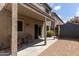This patio features a table and chairs, a shed, and a sliding door at 2721 E Schiliro Cir, Phoenix, AZ 85032