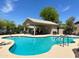 This is a community pool with a covered area and plenty of lounge chairs at 2721 E Schiliro Cir, Phoenix, AZ 85032