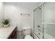 Bathroom with a white sink, wood cabinets, and a shower with sliding glass doors at 3601 W Tierra Buena Ln # 168, Phoenix, AZ 85053