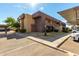 Exterior of a two-story apartment building with covered parking and green landscaping on a clear day at 3601 W Tierra Buena Ln # 168, Phoenix, AZ 85053