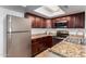 The kitchen offers tile floors, stainless steel appliances, and granite countertops at 3601 W Tierra Buena Ln # 168, Phoenix, AZ 85053