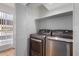 Convenient laundry room featuring modern LG washer and dryer, with a shelf for extra storage space at 3601 W Tierra Buena Ln # 168, Phoenix, AZ 85053