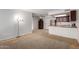 Open concept living space featuring carpeting, tile, stainless appliances and a ceiling fan at 3601 W Tierra Buena Ln # 168, Phoenix, AZ 85053