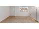 Bright living room with neutral carpet, tile flooring, a door and large window with blinds at 3601 W Tierra Buena Ln # 168, Phoenix, AZ 85053