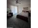 Comfortable bedroom featuring carpet, natural light, and a full bed at 3749 E Laurel Ln, Phoenix, AZ 85028