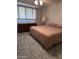 Cozy bedroom featuring neutral walls, carpet flooring, and a double bed with ample natural light through the windows at 3749 E Laurel Ln, Phoenix, AZ 85028