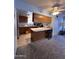 Functional kitchen features wood cabinets, breakfast bar and ample counter space, offering both style and convenience at 3749 E Laurel Ln, Phoenix, AZ 85028